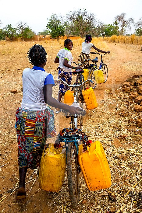 Girls fetching water in a village near Ouahigouya, Burkina Faso.