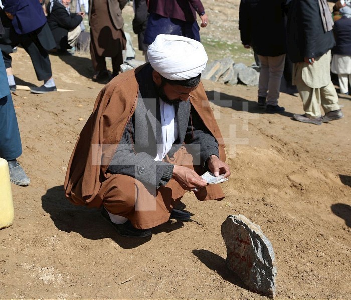 (200307) -- KABUL, March 7, 2020 (Xinhua) -- An Afghan man prays on the tomb of a victim in a shooting attack during a funeral in Kabul, capital of Afghanistan, March 7, 2020. United Nations Secretary-General Antonio Guterres has strongly condemned a shooting attack in Afghan capital Kabul, his spokesperson said Friday.     The attack, which took place at a commemoration of the death anniversary of politician Abdul Ali Mazari, killed at least 31 people, including 29 civilians, and wounded 55 others. (Xinhua/Rahmatullah Alizadah) Xinhua News Agency / eyevine  Contact eyevine for more information about using this image: T: +44 (0) 20 8709 8709 E: info@eyevine.com http://www.eyevine.com . AFGHANISTAN-KABUL-SHOOTING ATTACK-VICTIM-FUNERAL