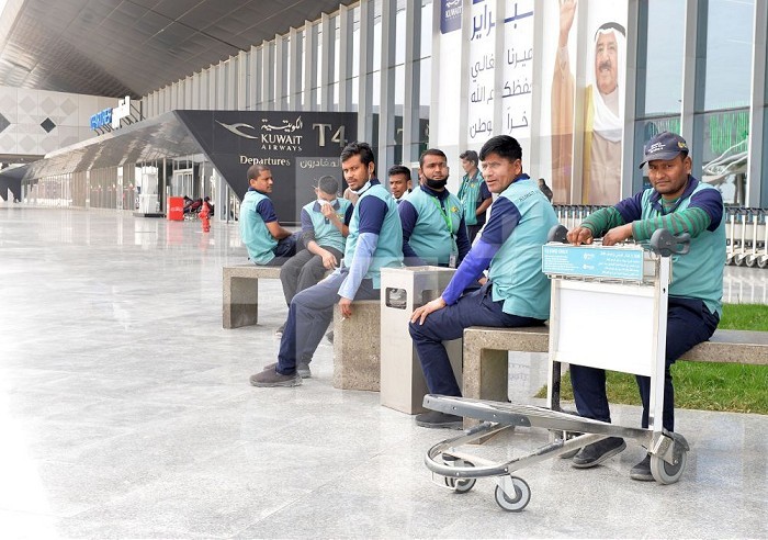 (200312) -- FARWANIYA GOVERNORATE, March 12, 2020 (Xinhua) -- Workers sit at Kuwait International Airport in Farwaniya Governorate, Kuwait, March 12, 2020. Kuwait has decided on Wednesday to suspend the commercial flights to and from the country starting from March 13. Kuwait reported eight new COVID-19 cases over the past 24 hours, bringing the total number of coronavirus cases in the country to 80, the Ministry of Health said Thursday. (Photo by Asad/Xinhua) Xinhua News Agency / eyevine  Contact eyevine for more information about using this image: T: +44 (0) 20 8709 8709 E: info@eyevine.com http://www.eyevine.com . KUWAIT-FARWANIYA GOVERNORATE-COVID-19-COMMERCIAL FLIGHT-SUSPENSION