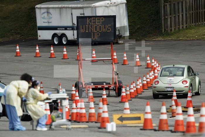 (200319) -- ARLINGTON (U.S.), March 19, 2020 (Xinhua) -- A car is seen at a drive-through COVID-19 testing location set up by the Virginia Hospital Center in Arlington, Virginia, the United States, on March 19, 2020. The number of COVID-19 cases in the United States topped 11,000 as of 4:40 p.m. local time on Thursday (2040 GMT), according to the Center for Systems Science and Engineering (CSSE) at Johns Hopkins University. (Photo by Ting Shen/Xinhua) Xinhua News Agency / eyevine  Contact eyevine for more information about using this image: T: +44 (0) 20 8709 8709 E: info@eyevine.com http://www.eyevine.com . U.S.-VIRGINIA-ARLINGTON-COVID-19-TEST