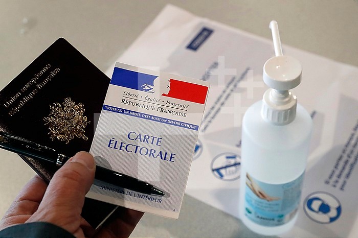 Polling station during the coronavirus epidemic ( COVID-19). Ballot and hydroalcoholic gel. Saint Gervais. France.