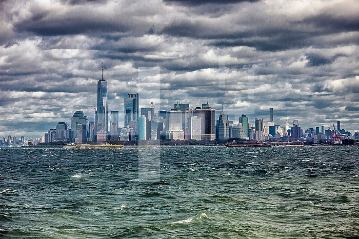 Manhattan Peninsula by gray clouds and rough sea, New York, United States, America.