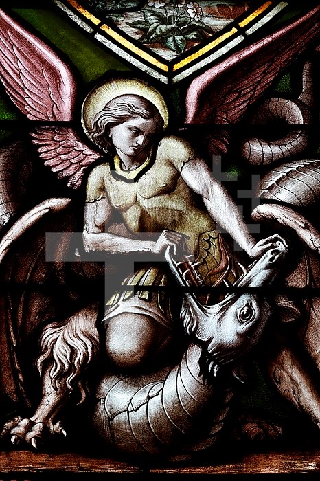 Basilica of Our Lady of Geneva. Stained glass window. Archangel Michael defeating evil as a dragon. Geneva. Switzerland.