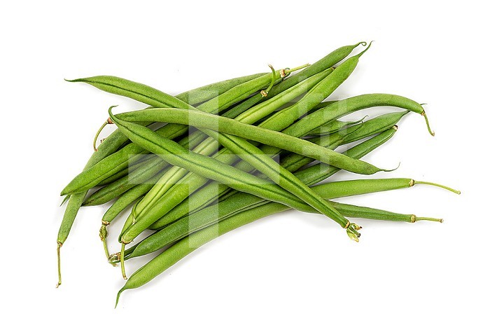 Handful of early green beans on a white background