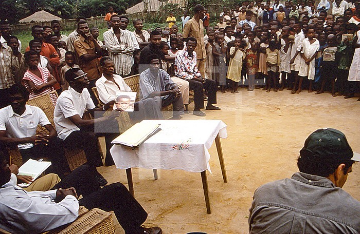 This historic 1997 image was created during an investigation into an outbreak of monkeypox, which took place in the Democratic Republic of Congo (DRC), from 1996 to 1997, formerly Zaire. Pictured was the chief of Ekanga, as he led a meeting to educate his fellow citizens about monkeypox.