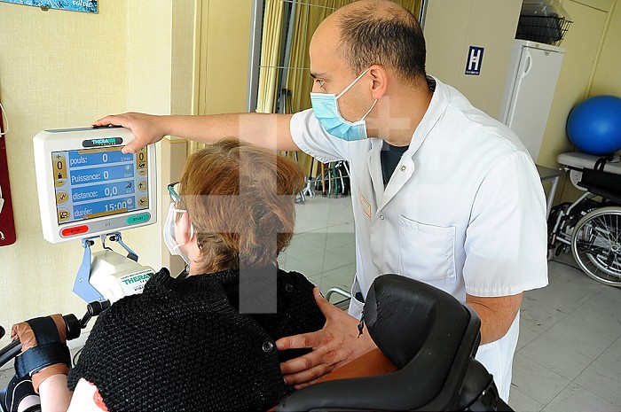 Physiotherapy session in the aftercare and rehabilitation department of a hospital.