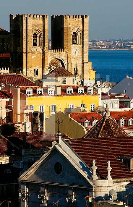 Portugal, Lisbon. View of the two towers flanking the facade of the cathedral, built shortly after Alfonso I conquered the city from the Muslims in 1147. Alfama district.. Portugal. Lisbon. Cathedral and Alfama neighborhood.
