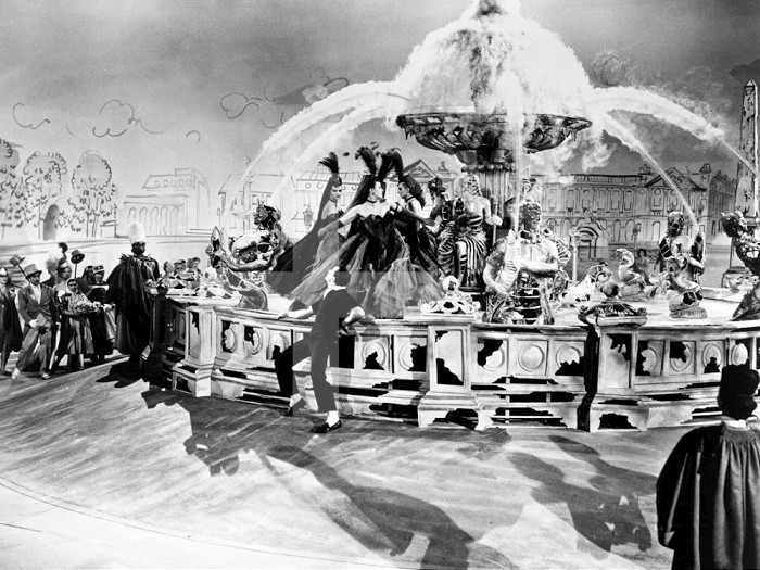 AN AMERICAN IN PARIS, 1951. /nGene Kelly on a set suggesting Place de la Concorde in Paris. Scene from the film 'An American in Paris,' 1951, inspired by George Gershwin's composition of the same name and directed by Vincent Minnelli.
