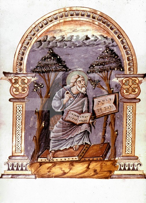 SAINT JOHN. Writing his gospel on Patmos. Miniature from a late 9th century French manuscript.